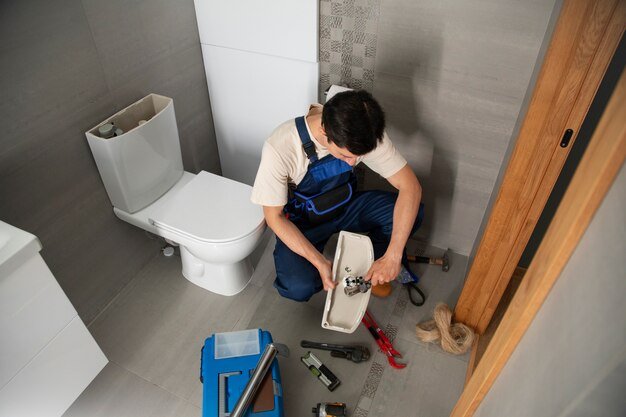 male-plumber-working-fix-problems-client-s-house_23-2150990706