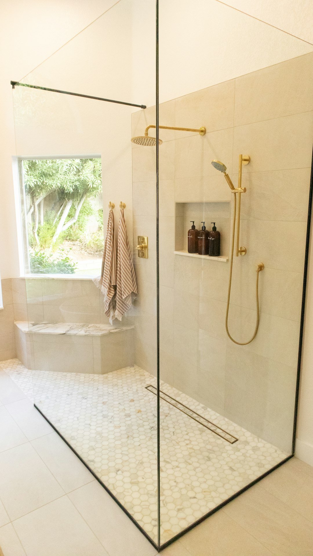 Bathroom with toilet and bath where a blockage is being cleared