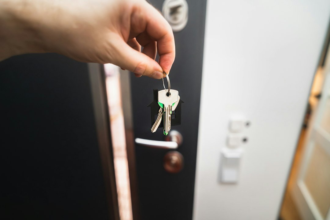 Locksmith repairing a front door lock in London