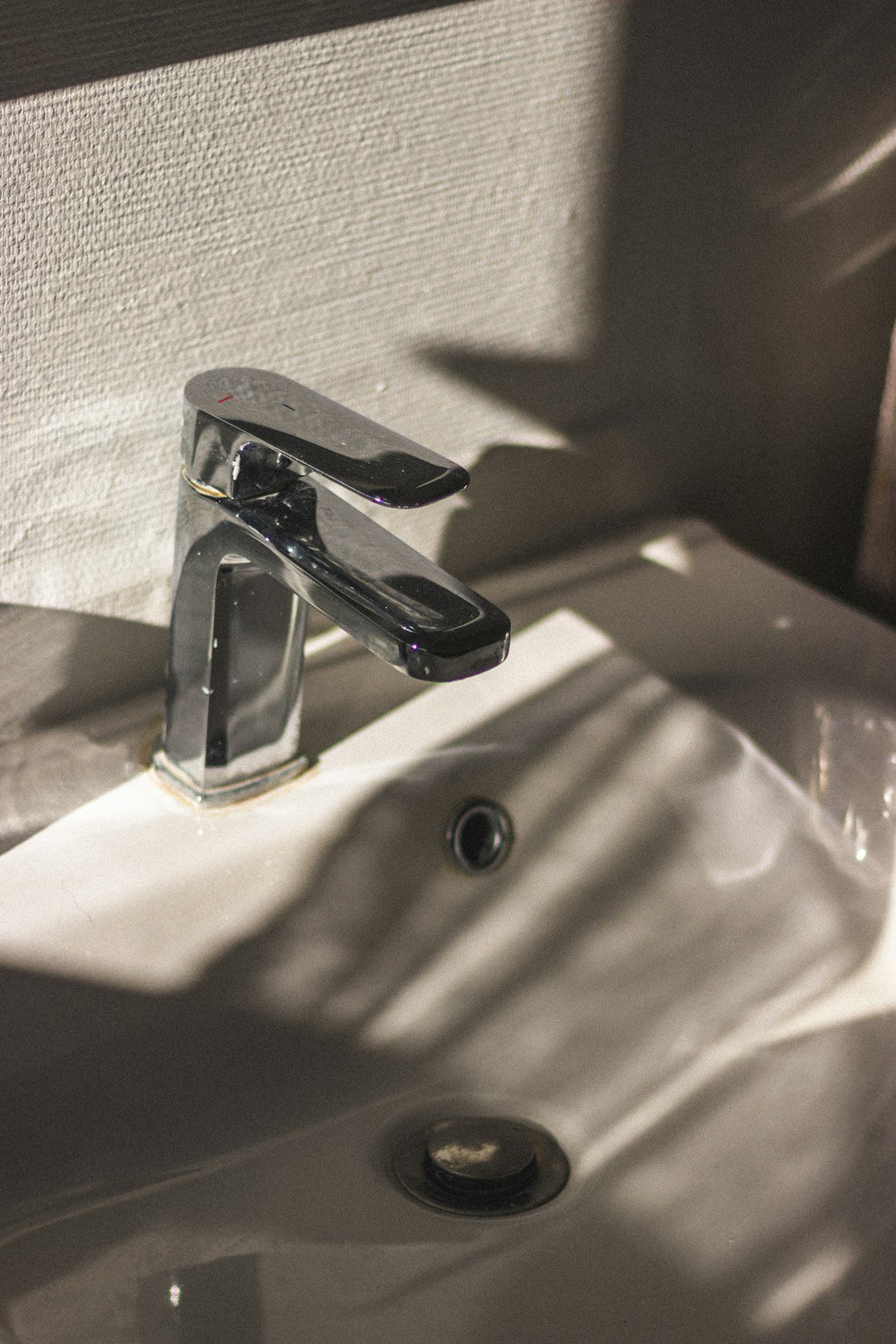 White ceramic basin and toilet in a UK bathroom