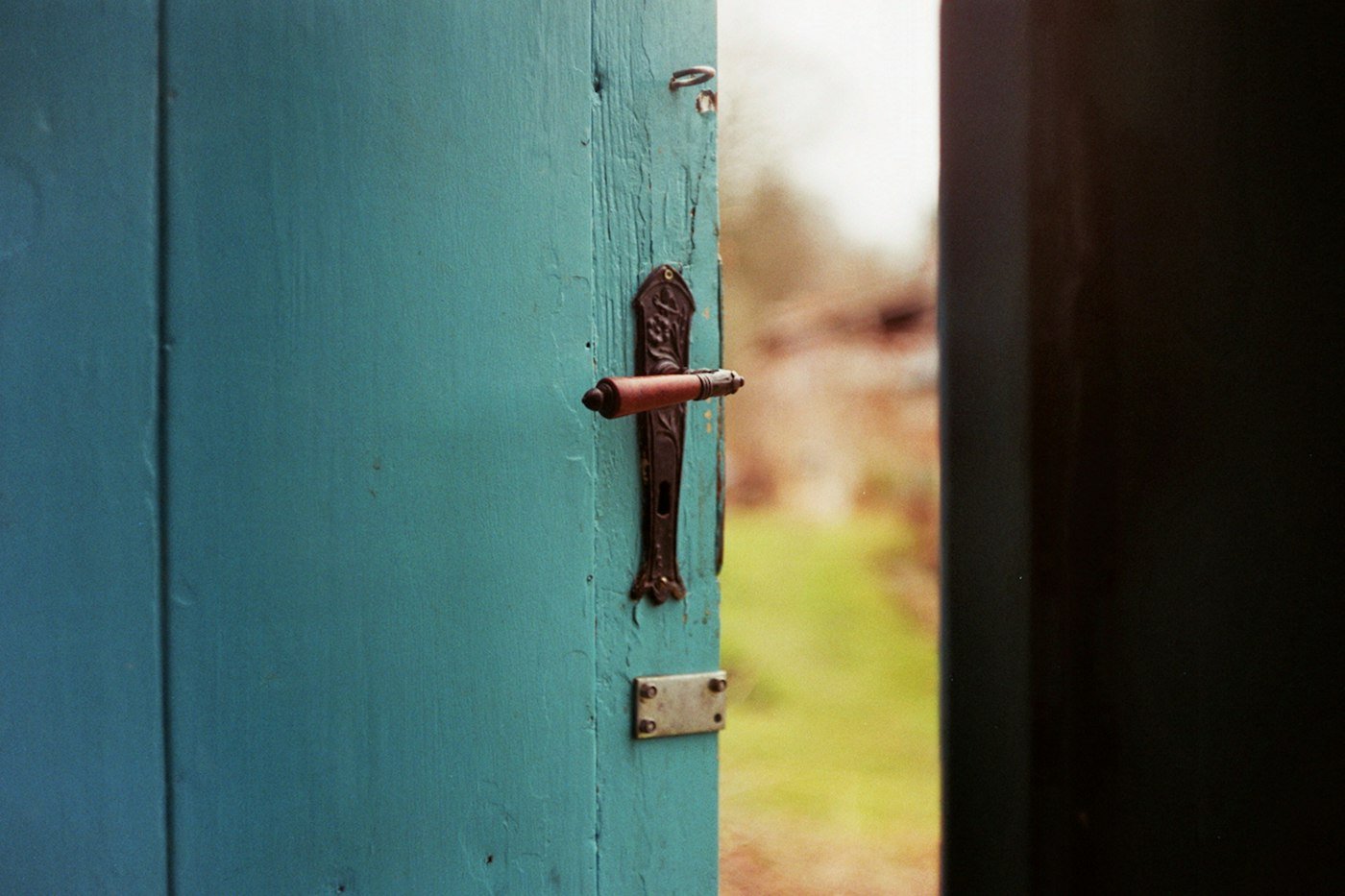 Door handle and mortice lock hardware on a front door