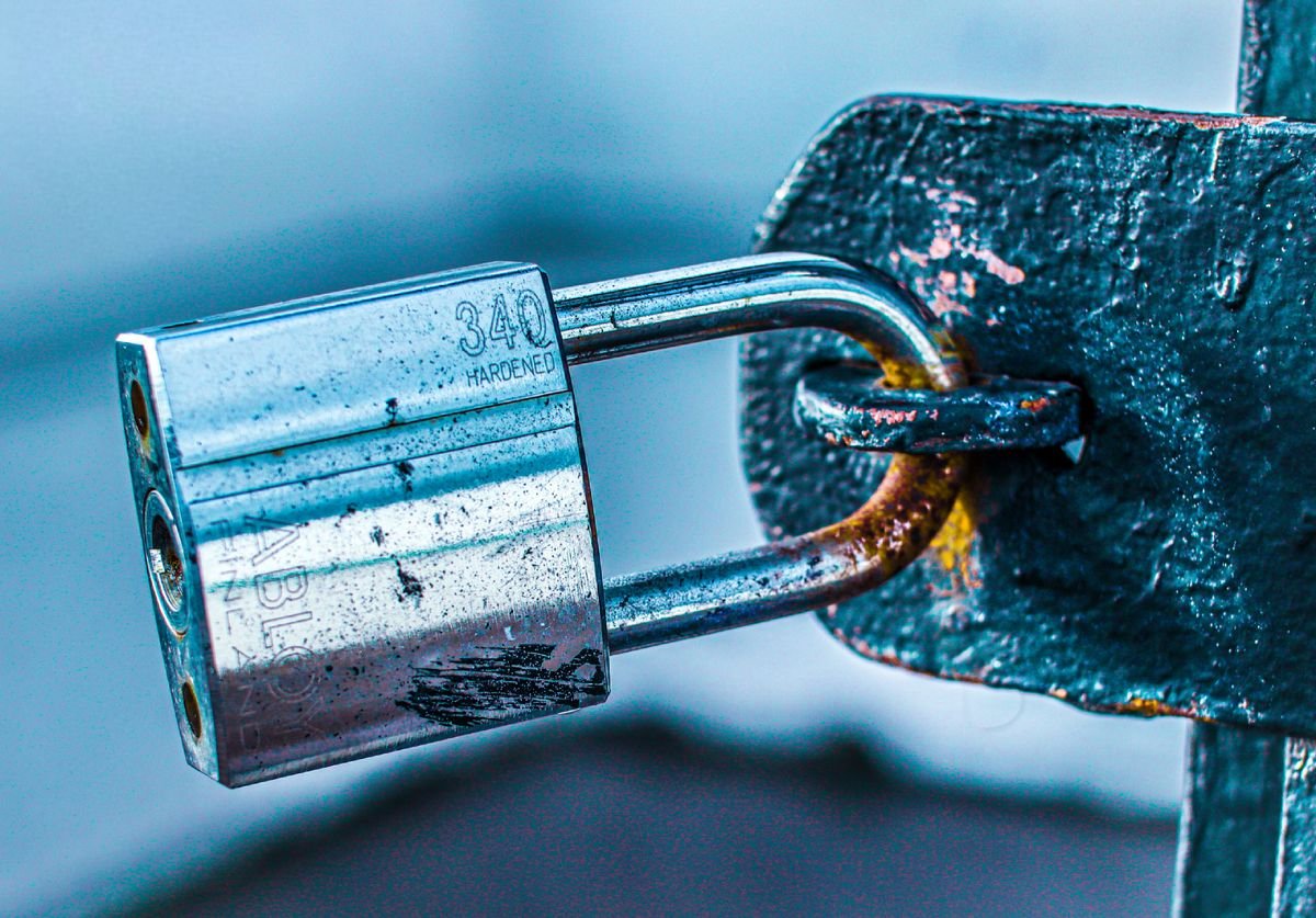Locksmith in Chiswick fitting a door lock