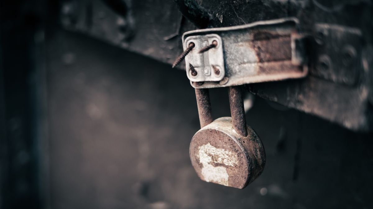 Locksmith securing a door after a break-in