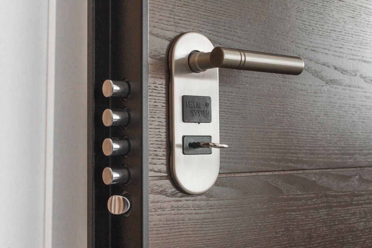 Locksmith in Kensington fitting a door lock