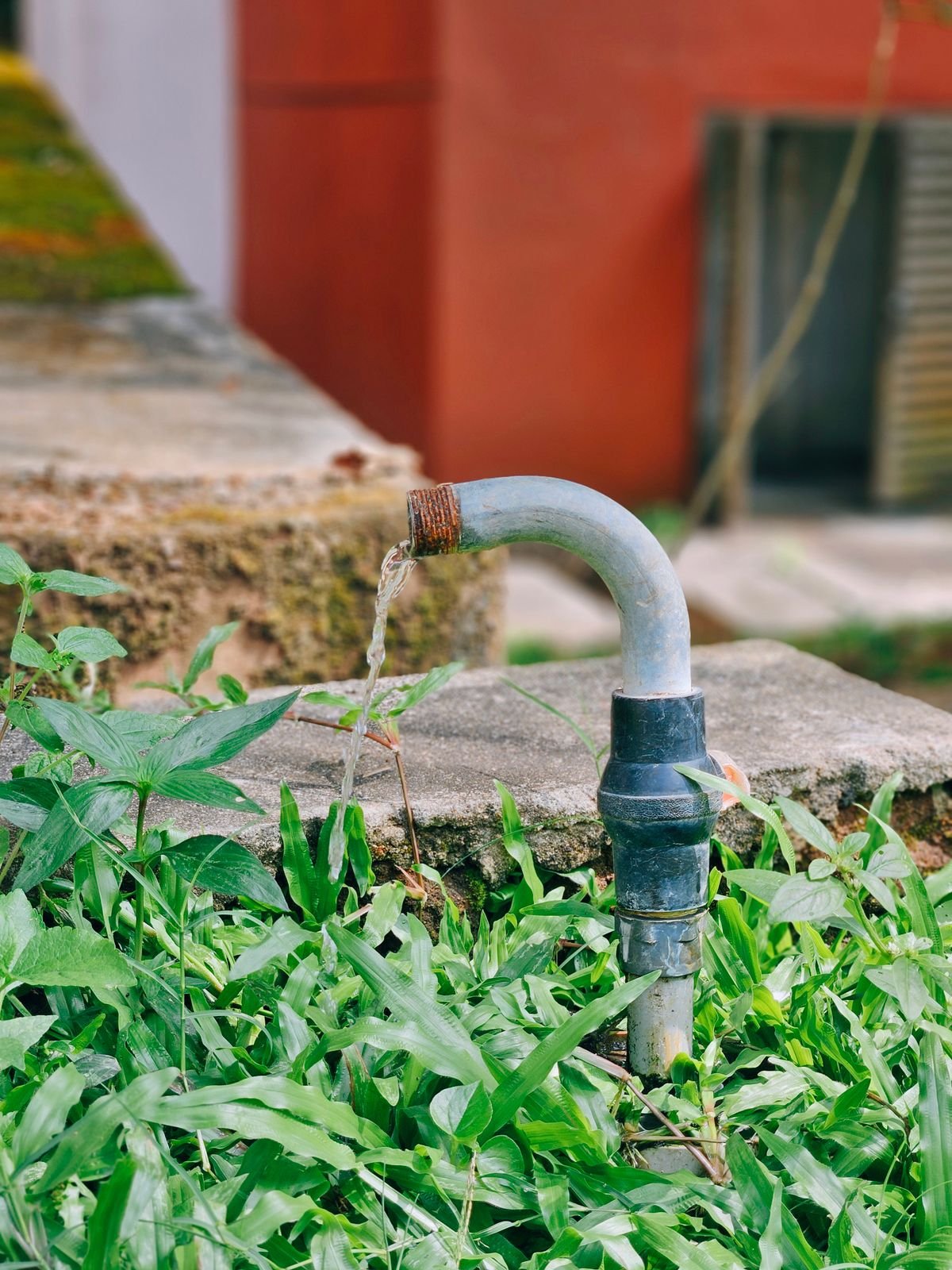 Plumber checking water pressure on pipework