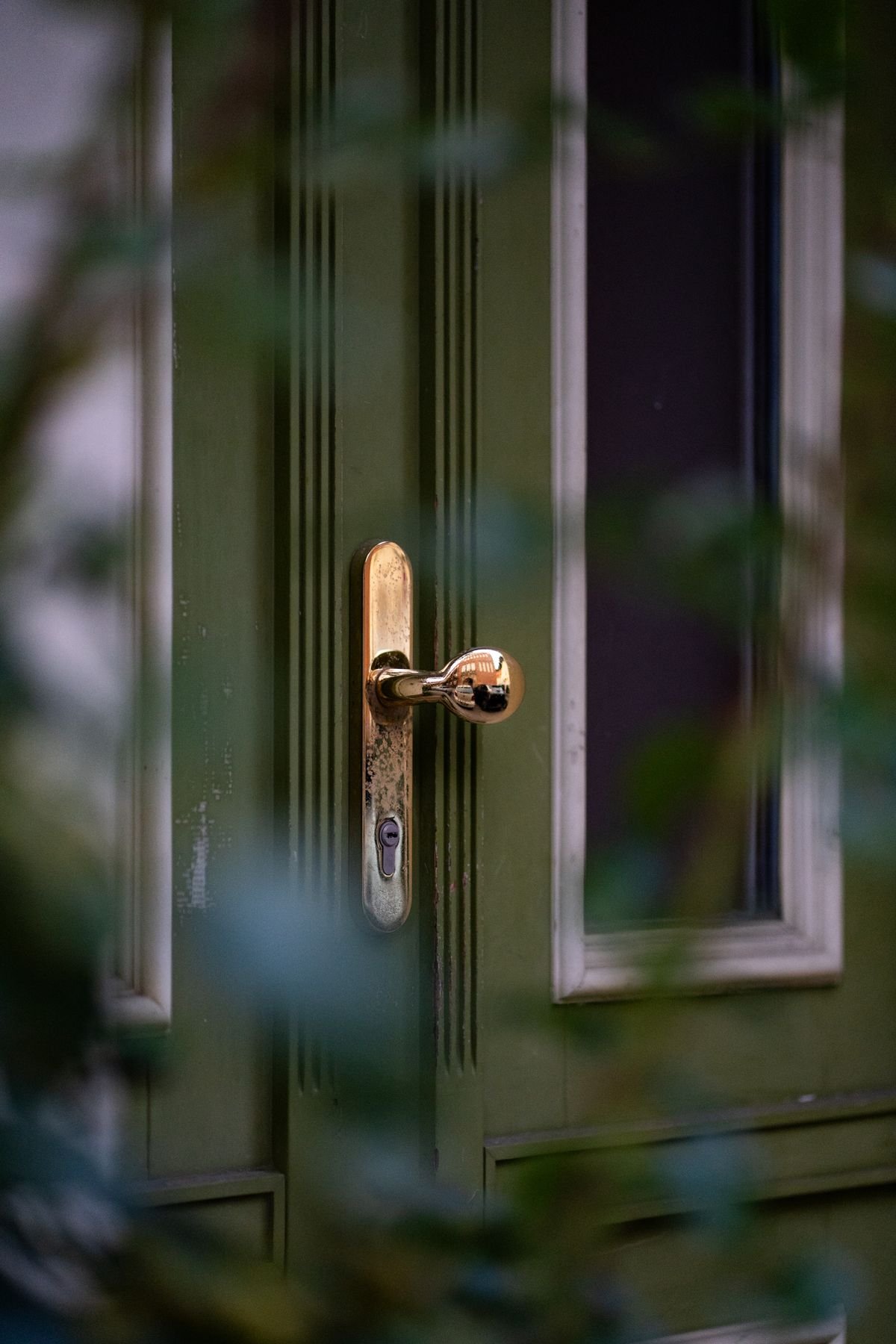 A locksmith repairing a multipoint locking mechanism on a uPVC door