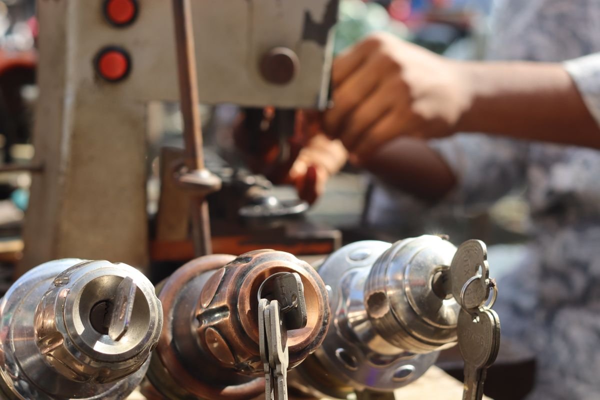 Locksmith in Virginia Water fitting a door lock