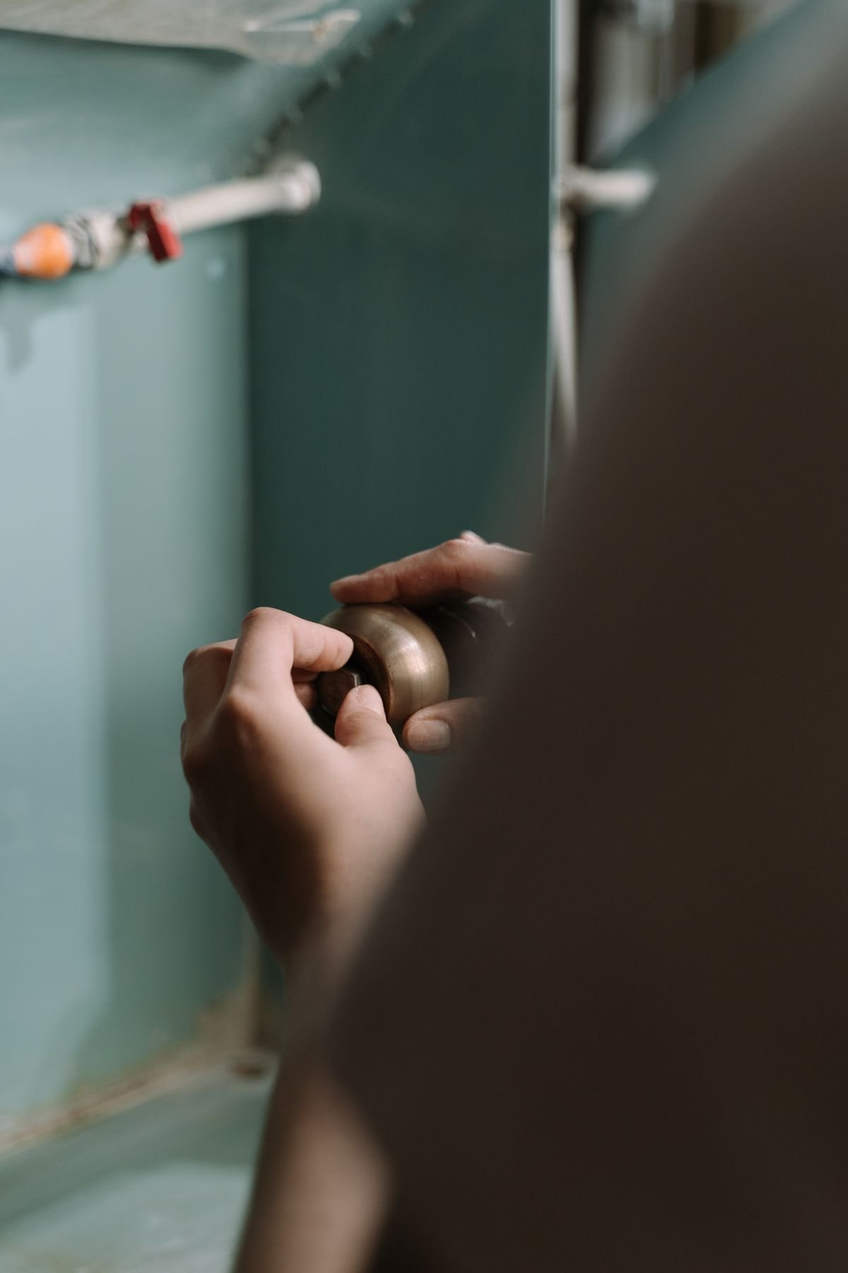Plumber in Amersham repairing pipework