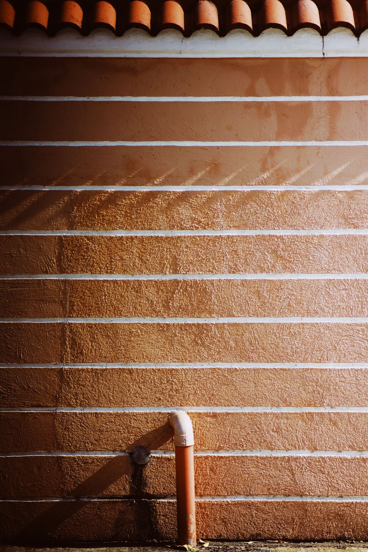 Plumber clearing a blocked sink waste
