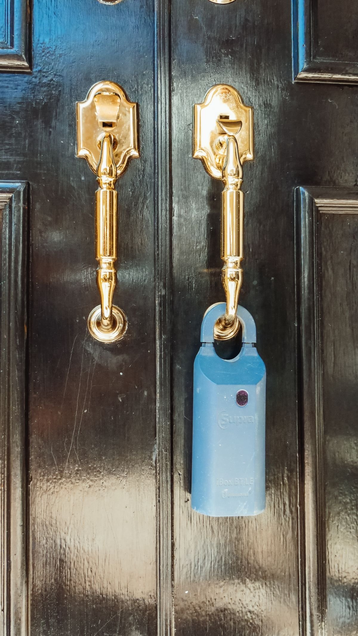 Locksmith fitting a new cylinder on a front door