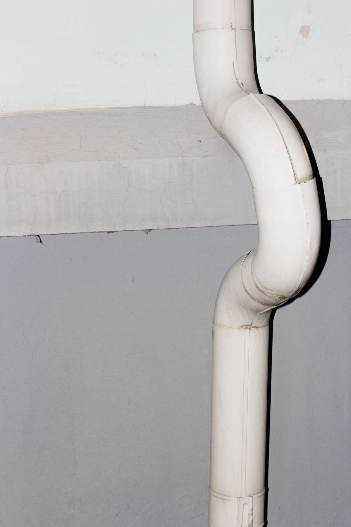 Plumber tracing a hidden pipe leak
