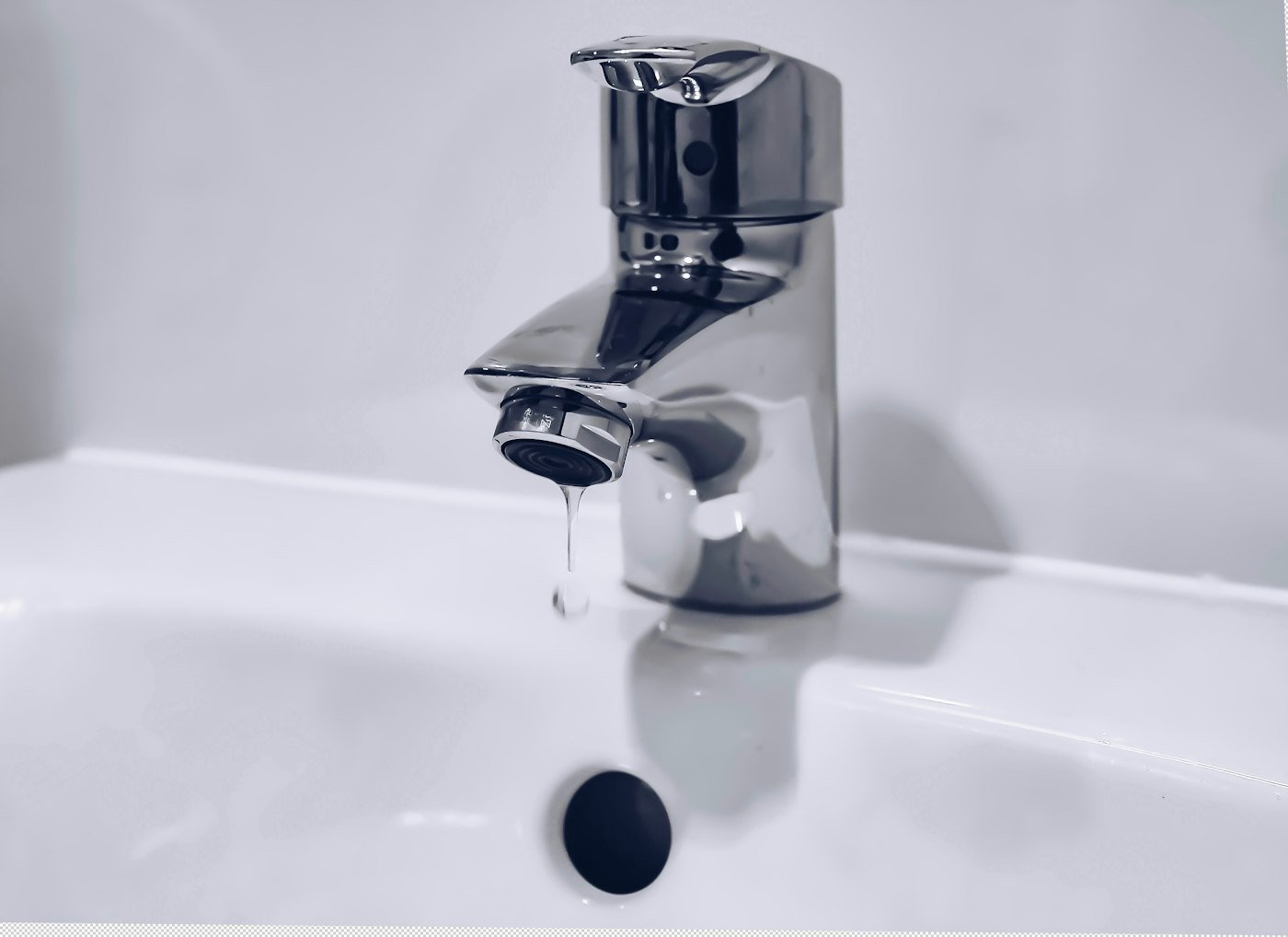 Close-up of a dripping basin tap